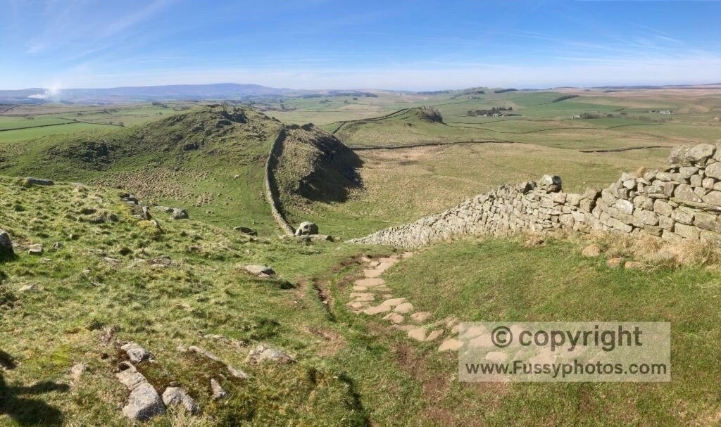 Photo of Hadrian’s Wall looking west near Whinshields Crag, on the long section where the Pennine Way follows the Wall before turning north at Rapishaw Gap.