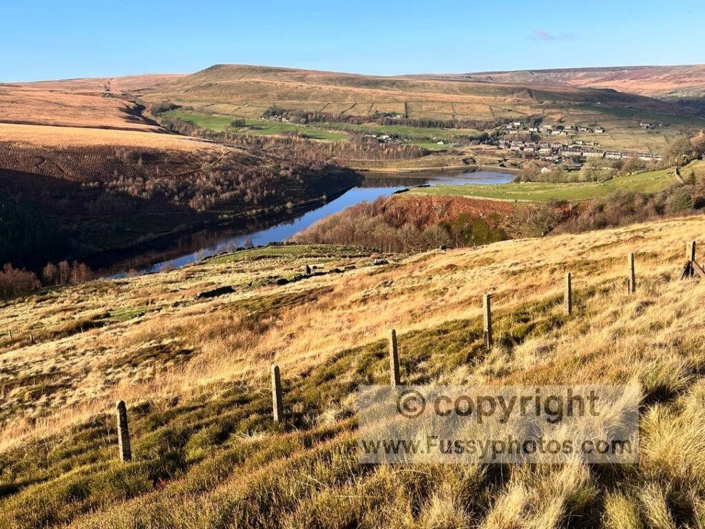 Elevated views of Butterley Reservoir and Marsden with Pule Hill in the background