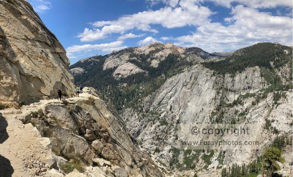 The Watchtower Trail tracing the edge of dramatic granite drop‑offs.