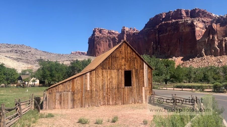 The historic Gifford Barn in Fruita, surrounded by other preserved pioneer buildings.