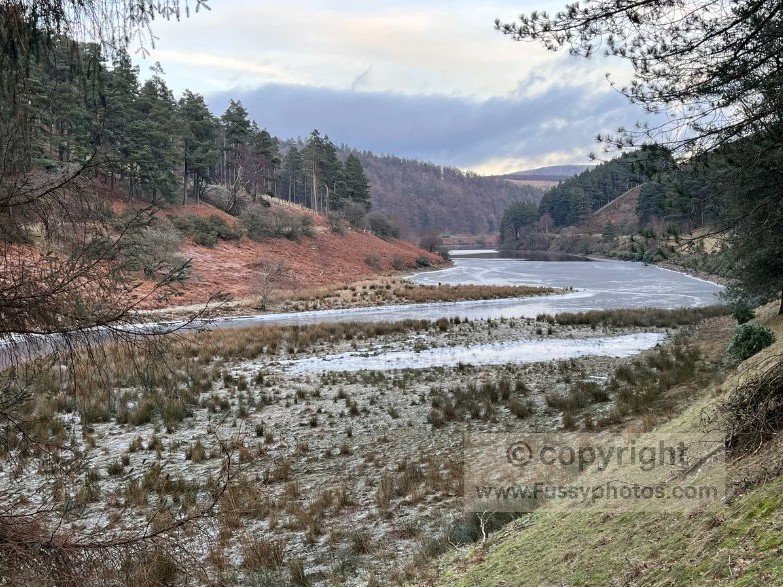 Winter view across a partially frozen Howden Reservoir