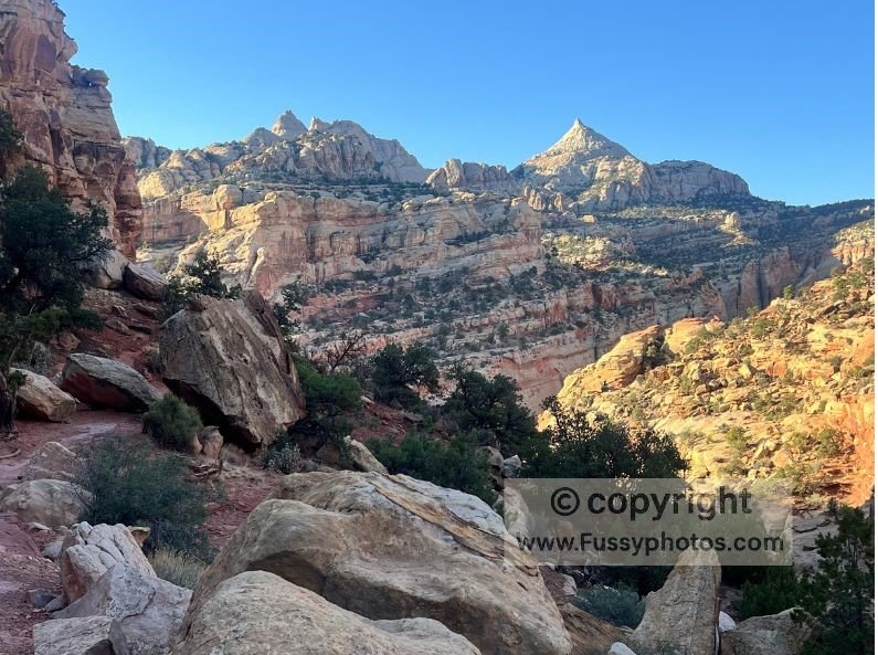 Trail leveling out along Capitol Reef’s canyon walls with the Nipple coming into view.