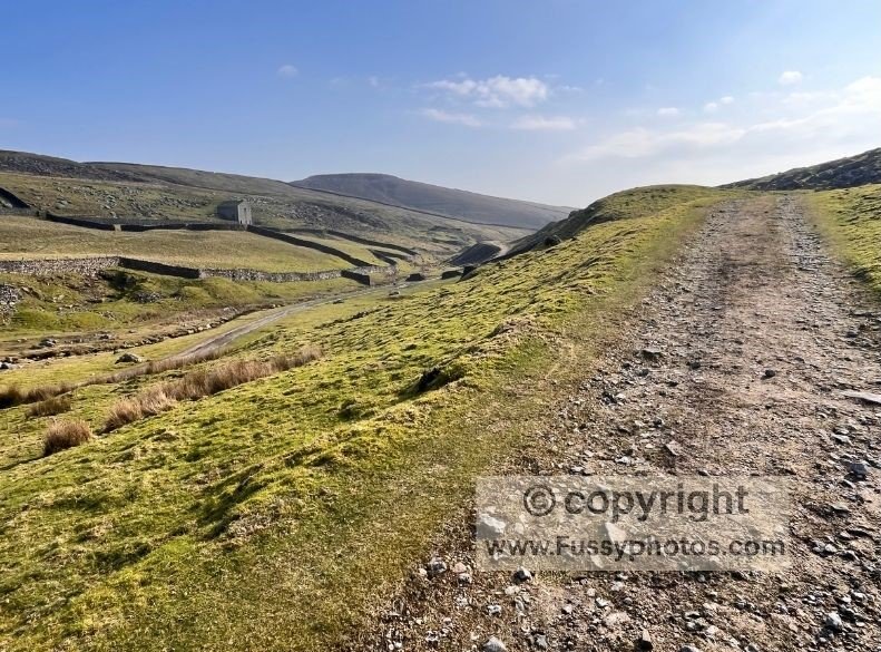 Limestone landscape near the historic lead mines north of Hole Bottom, where the trail climbs onto open moorland on the Grassington circular walk.