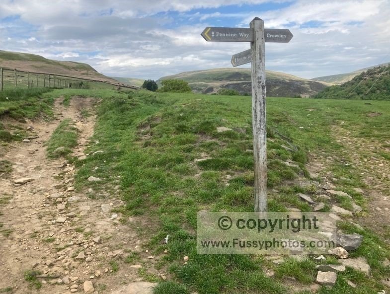 Pennine Way signpost near Crowden indicating the direction to Laddow Rocks and nearby escape routes.