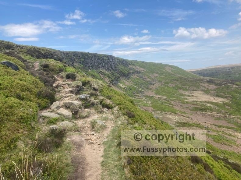 View of Laddow Rocks on the Pennine Way during the steep climb out of Crowden towards Black Hill.