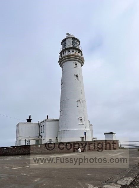 Flamborough Lighthouse on the clifftop, overlooking the eastern tip of Flamborough Head.