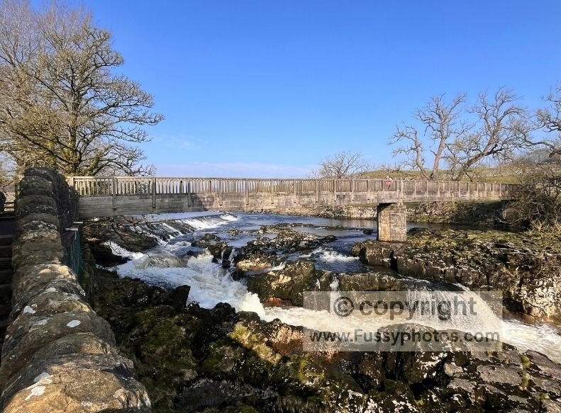 Upstream view of Linton Falls from the viewpoint beside the cascades on the Dales Way near Grassington.