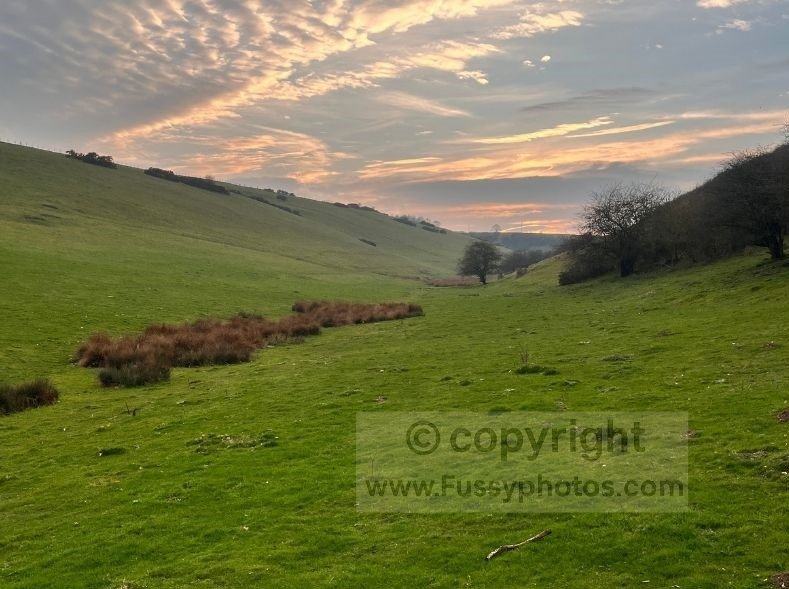 View looking west along Brownmoor Dale at sunset in the Yorkshire Wolds, showing the quiet dry valley on the approach back to Thixendale.