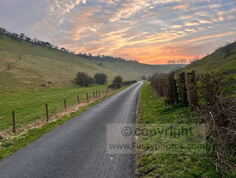Sunset view looking west along the road in Water Dale, a peaceful dry valley in the Yorkshire Wolds near Thixendale.