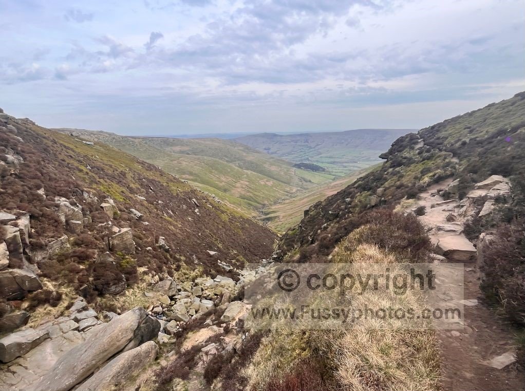Looking down the valley of Crowden Brook from near Crowden Tower, with water falling from the Kinder Scout plateau.