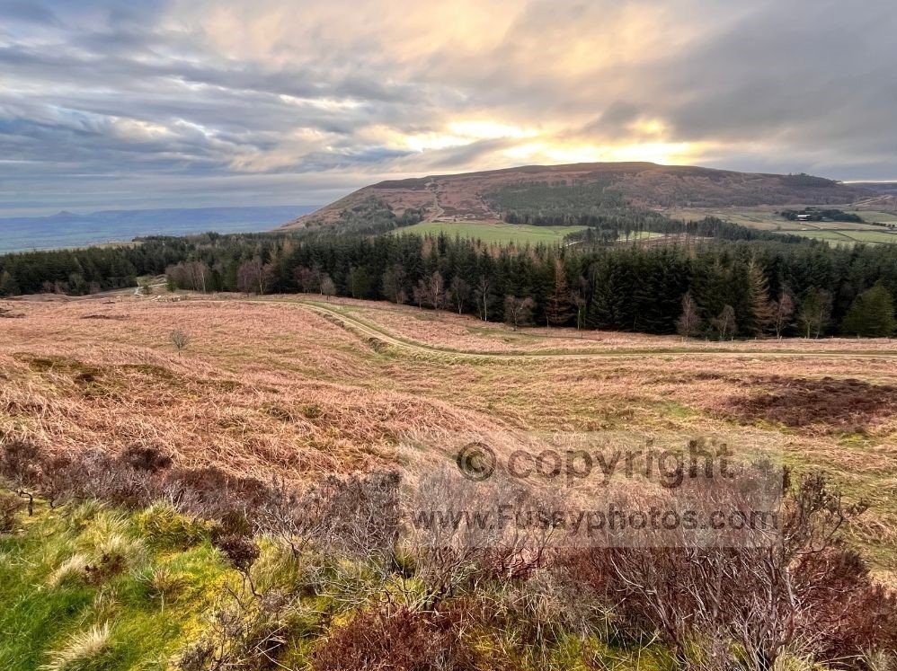 Early morning sunrise lighting up Charlton Bank on the Coast to Coast route, with clear skies to the east.