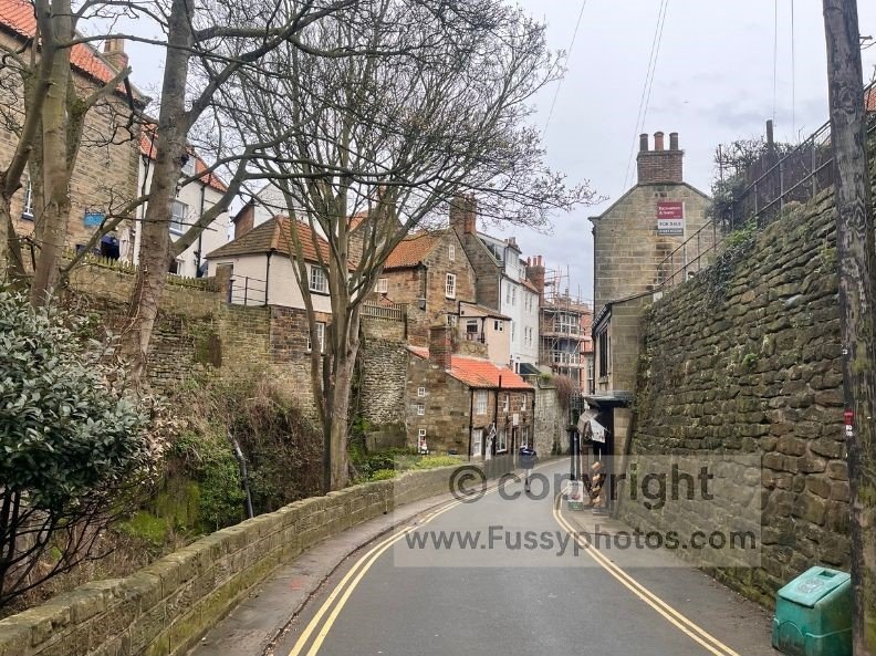 Photo of the Coast to Coast route ascending the steep hill in Robin Hood’s Bay, taken just after starting the trail.