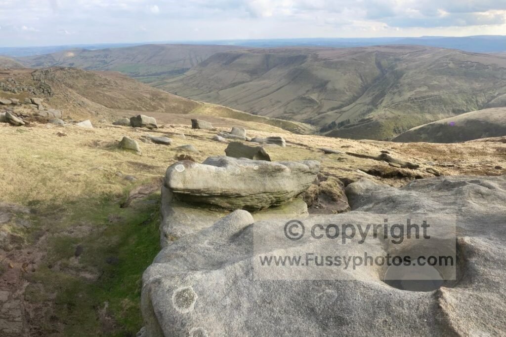 View from Kinder Low looking southeast, showing the elevation change between the plateau and Edale Valley.