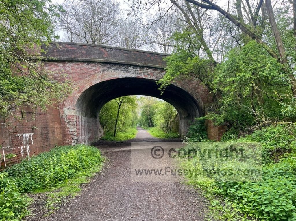 Trail view of the Yorkshire Wolds Way using the Hudson Way into Market Weighton, shown beneath a bridge on the former Beverley–Market Weighton railway line.