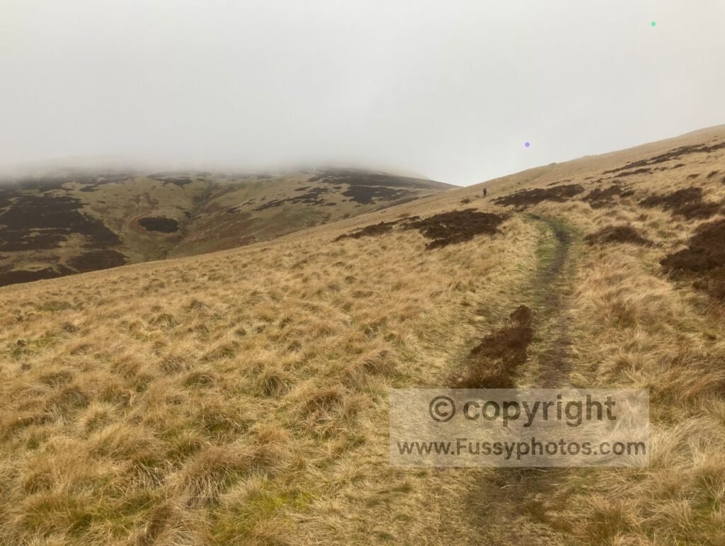 Uphill approach to the Pennine Way trail junction in poor visibility.