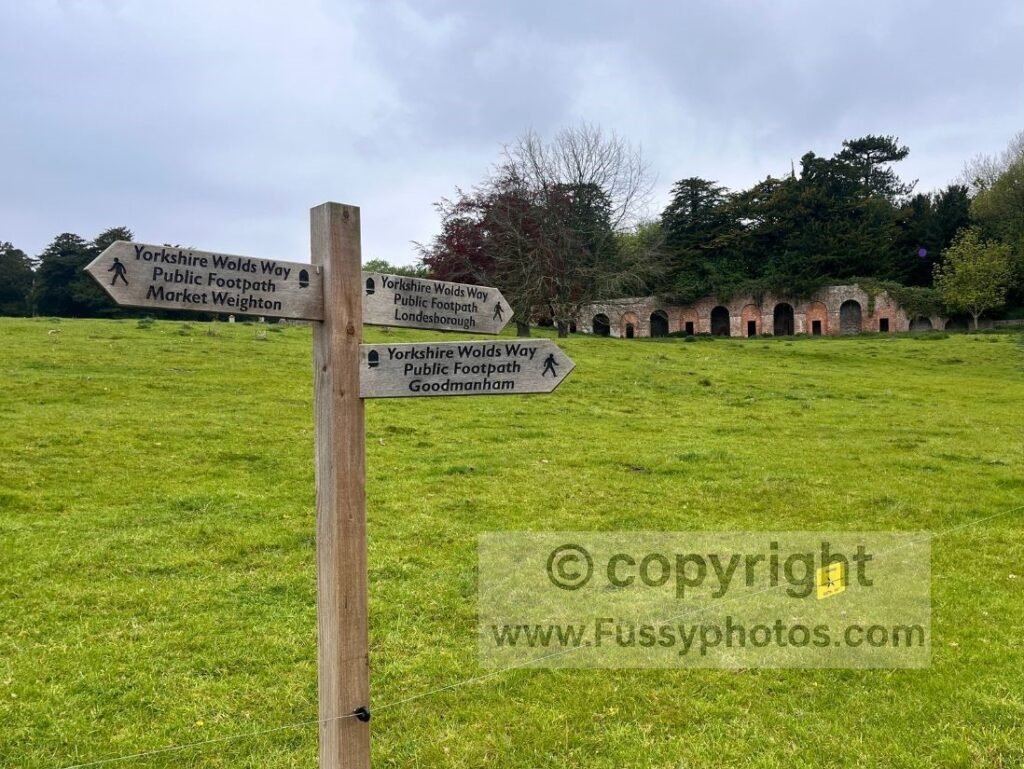 Trail junction fingerpost in Londesborough on the Yorkshire Wolds Way, showing the straightforward signage that guides walkers through the route’s valleys and field paths.