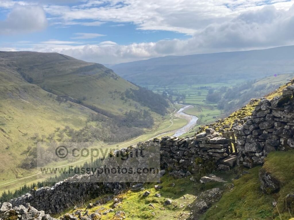 Elevated view of the River Swale winding through the valley towards Keld, seen from the Pennine Way above.