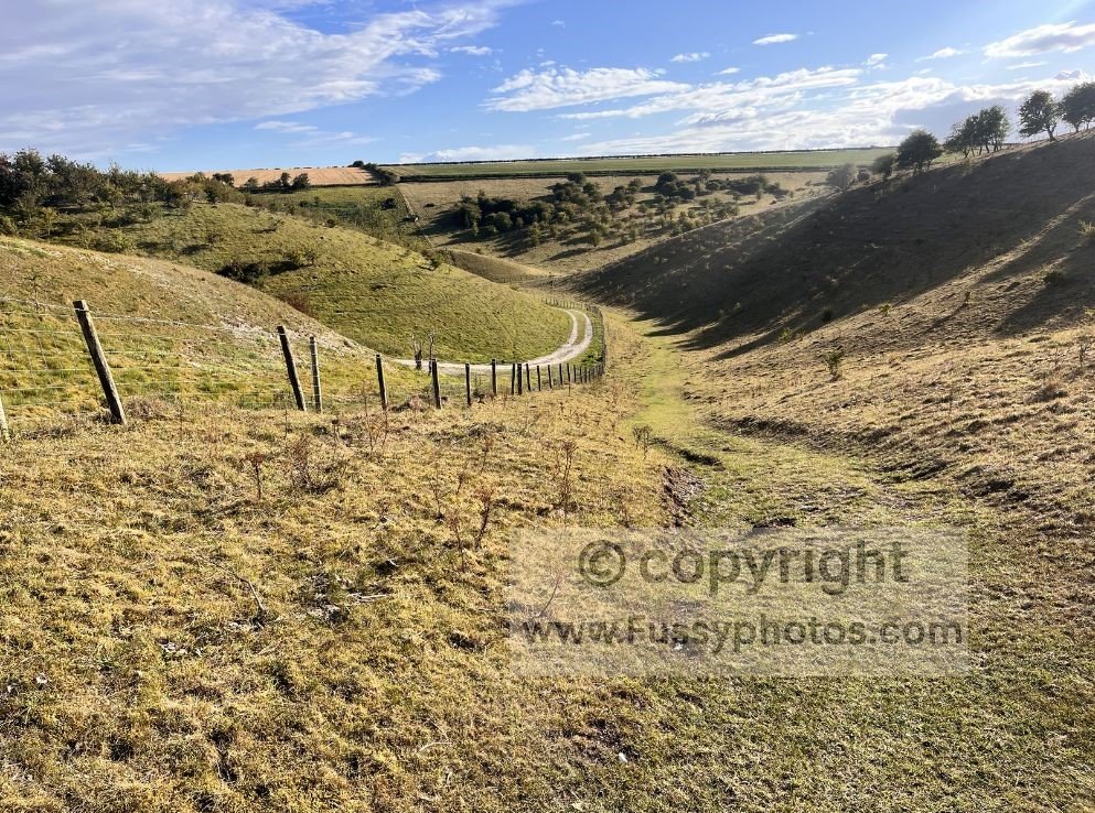 South‑facing view into Vessey Pasture Dale on the Wolds Way, showing the dry valley below as you leave it and begin the northward ascent.