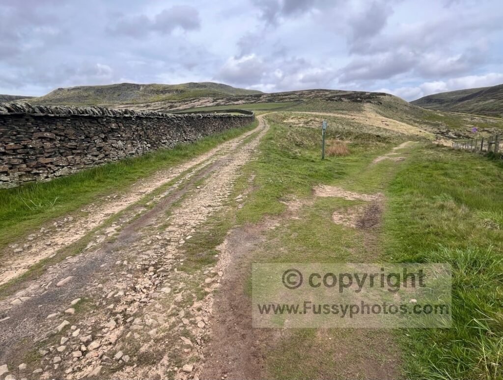 Trail junction on approach to Doctor’s Gate — View of a Y‑junction where the right‑hand path continues towards Doctor’s Gate and the left fork leads to the Bleaklow B‑29 crash‑site detour.