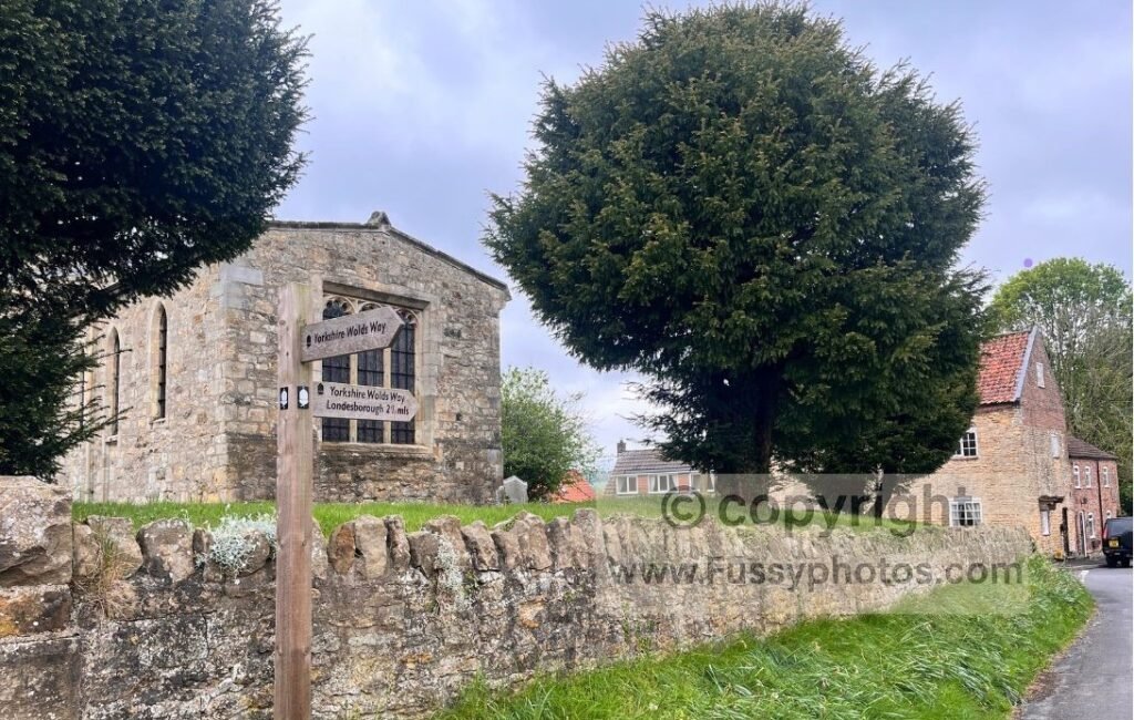 Scene in Goodmanham showing the small village on the Wolds Way, highlighting that no accommodation is available and walkers need to reach Market Weighton.