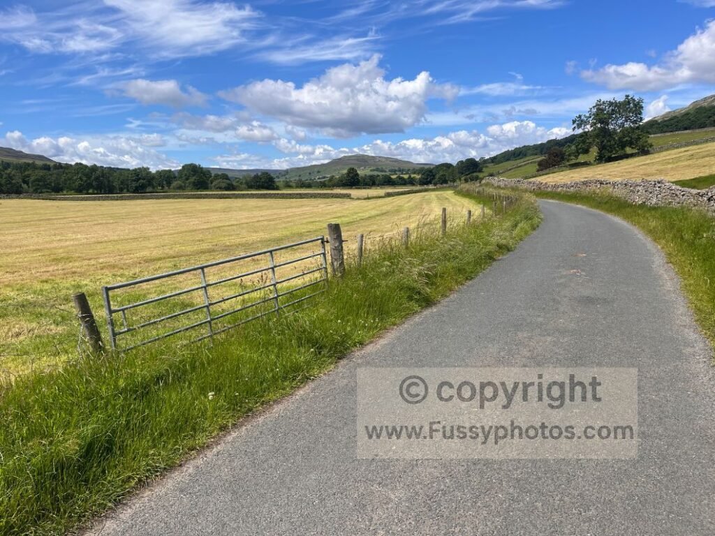 Marrick Reeth road — straight road section on the Coast to Coast Path before the river appears near Reeth.