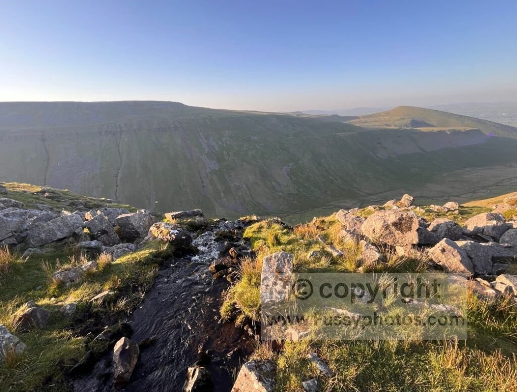 View along High Cup Nick towards Dufton, with a stream disappearing into the U‑shaped valley below.
