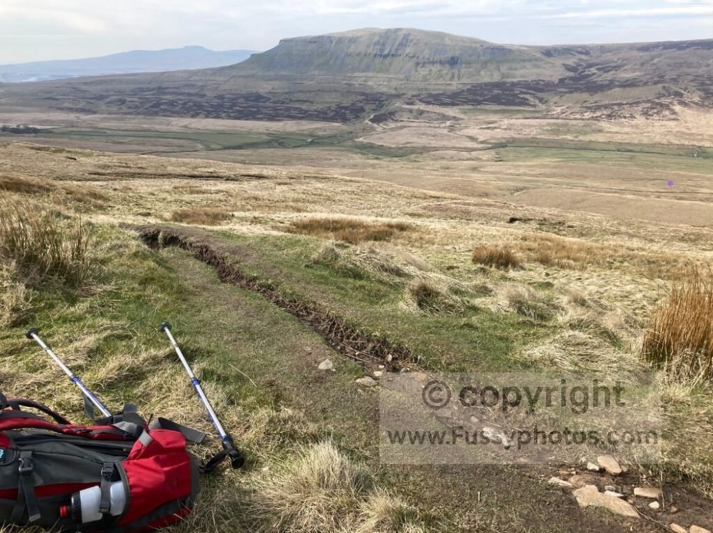 Distant view of Pen y Ghent across rolling moorland, showing the peak’s distinctive outline above the foreground plateau.