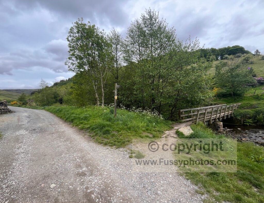 Bridge near Old Glossop — Small footbridge crossing a stream on the edge of Old Glossop, marking the optional detour around Shire Hill before rejoining the route at Mossy Lea.