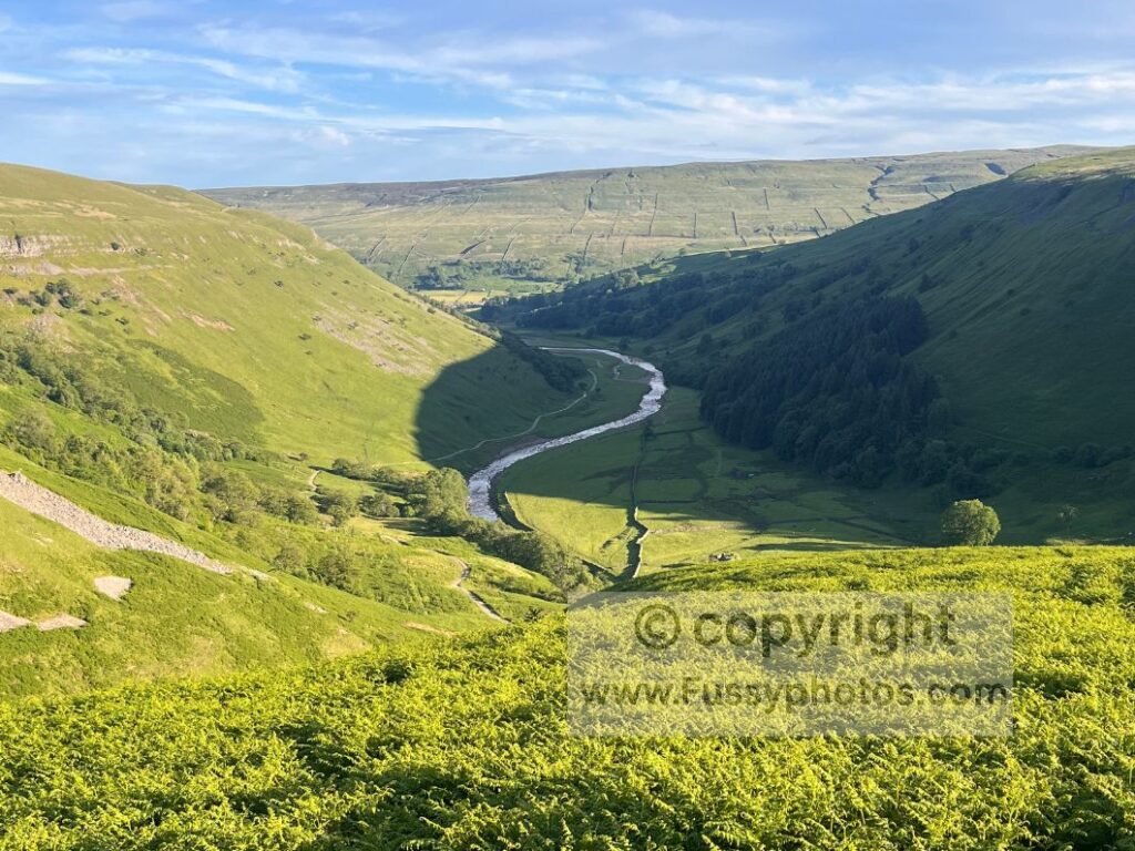 Coast to Coast viewpoint near Swinner Gill, overlooking Swaledale with the low‑level alternative visible on the left.