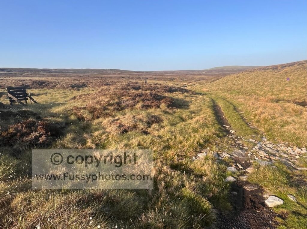 Tyre‑marked moor track alt — View of tyre‑marked tracks crossing open moorland above Dufton, showing how straightforward walking can still lead off the mapped route.