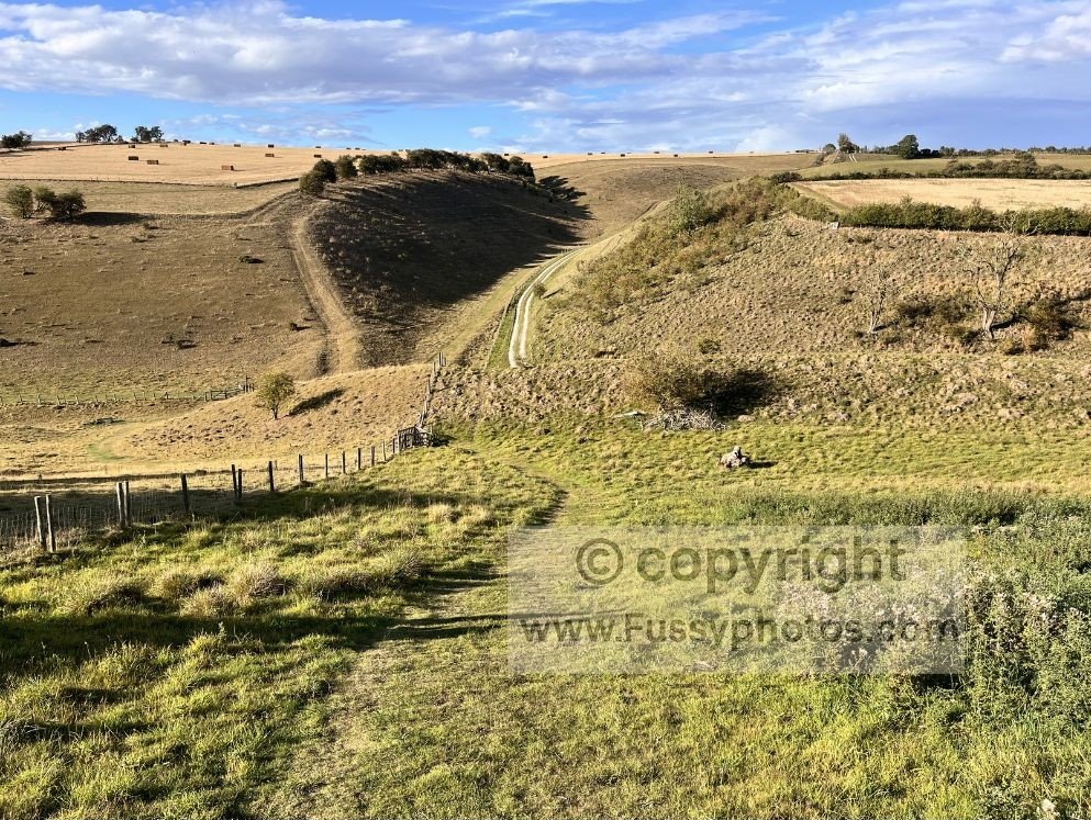 View into Vessey Pasture Dale on the Wolds Way, showing the descent into the dry valley and the climb out before the route continues towards Deep Dale and Wharram Percy.