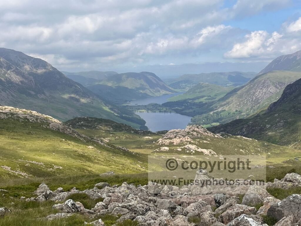 Looking northwest from the traditional Coast to Coast at roughly 600m, showing the hanging valley between Haystacks and Dale Head with Buttermere and Crummock Water visible beyond.