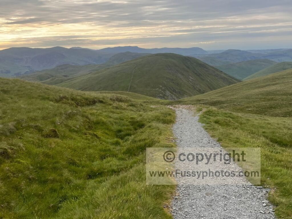 Coast to Coast trail descending with Rest Dodd centred ahead in fading light.