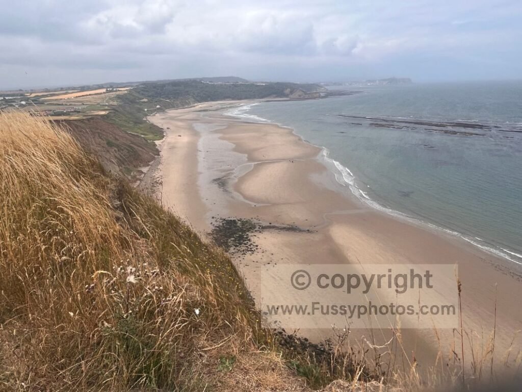 Panoramic view north from the top of Lebberston Cliff, showing Cayton Bay, Castle Cliff and distant Scarborough along the Cleveland Way.