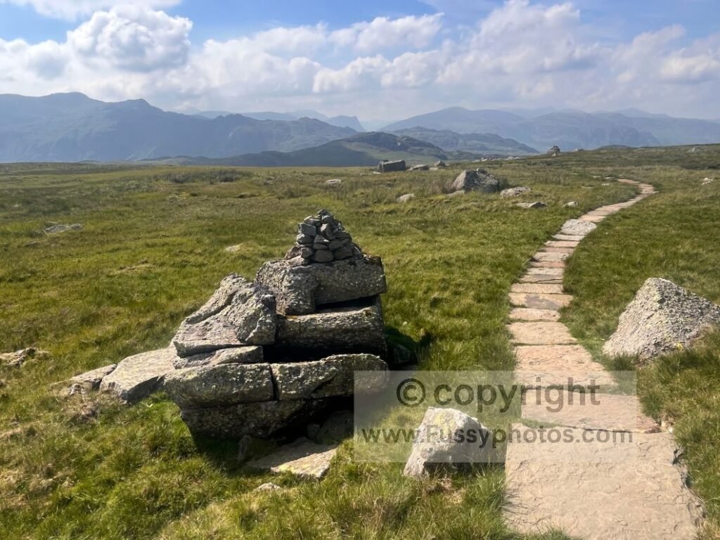 Paving stones and erratics on the plateau between Lining Crag and Greenup Edge.
