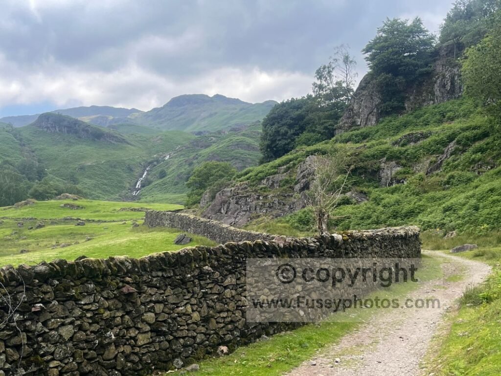 Distant waterfall above Easedale Beck on humid approach to Grasmere Common.