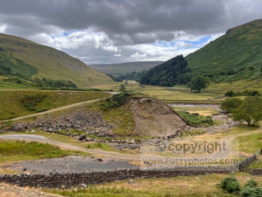 Swaledale low‑level view — view down Swaledale from the low‑level alternative near the wooden bridge.

