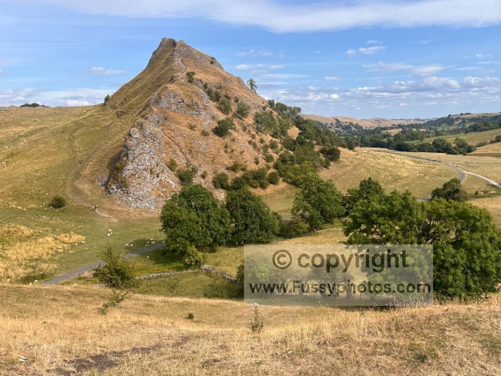 Steep eastern descent of Chrome Hill with Parkhouse Hill rising from the roadside at the base.