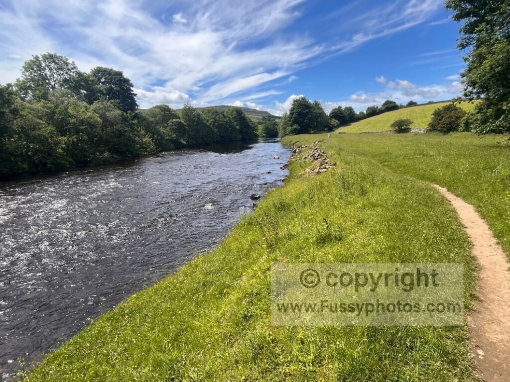 Open riverside section along the River Swale on the C2C route between Reeth and Richmond.