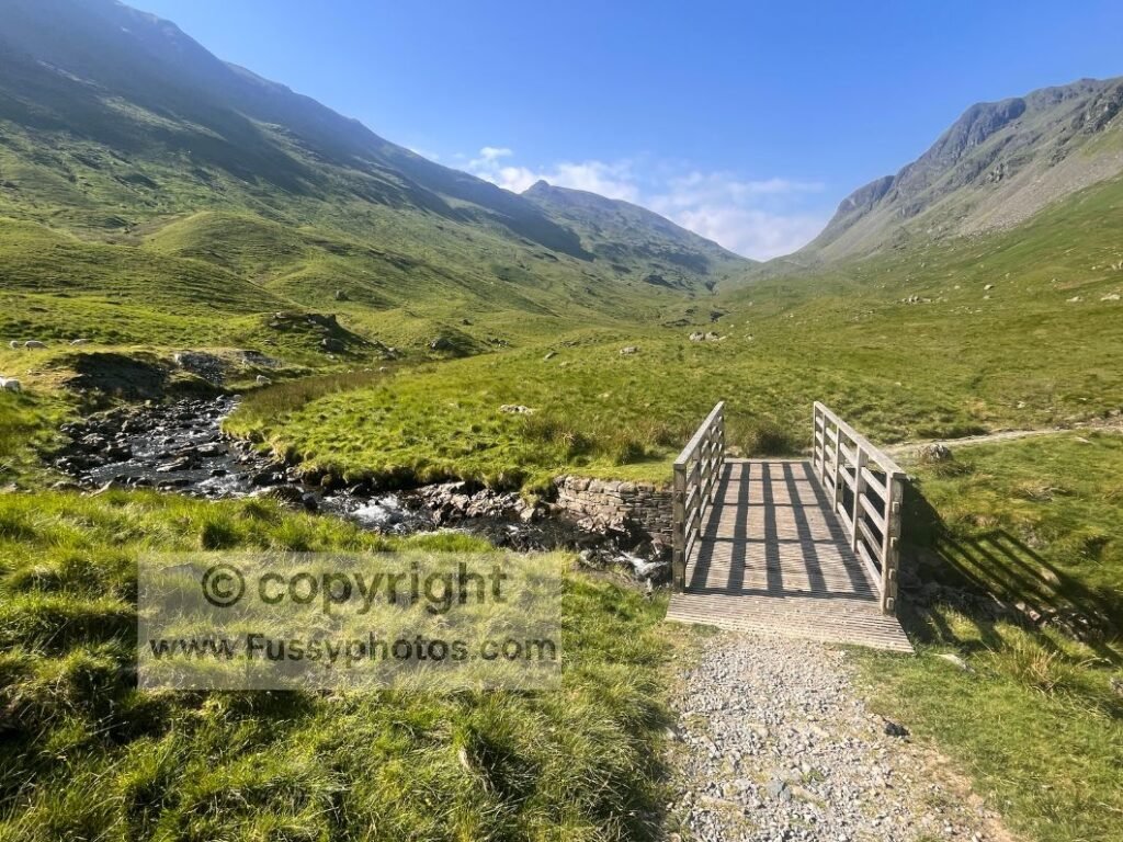Grisedale Valley in the Lake District on a hot summer Coast to Coast day, highlighting how heat affects walking pace and planning.
